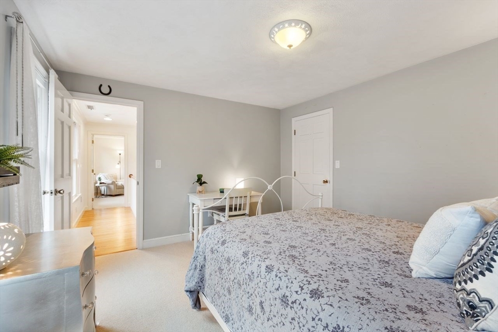 50 Hidden Road Andover, MA 01810 - Photo 28 of 42 a bedroom with a bed and a view of bathroom