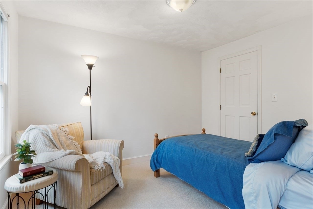 50 Hidden Road Andover, MA 01810 - Photo 29 of 42 a bedroom with furniture and a couch