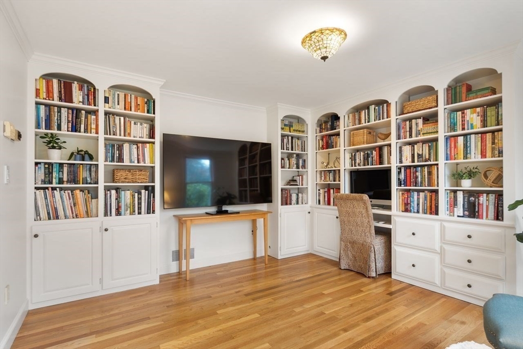 50 Hidden Road Andover, MA 01810 - Photo 5 of 42 a view of living room with furniture and book shelf