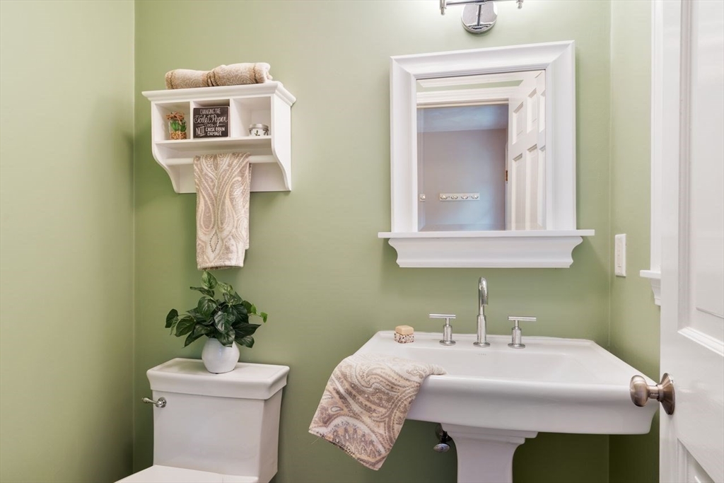 50 Hidden Road Andover, MA 01810 - Photo 10 of 42 a bathroom with a sink mirror and toilet