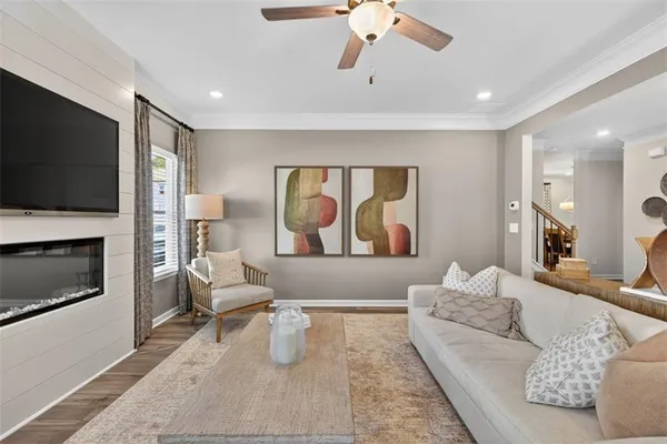 a living room with furniture and a flat screen tv