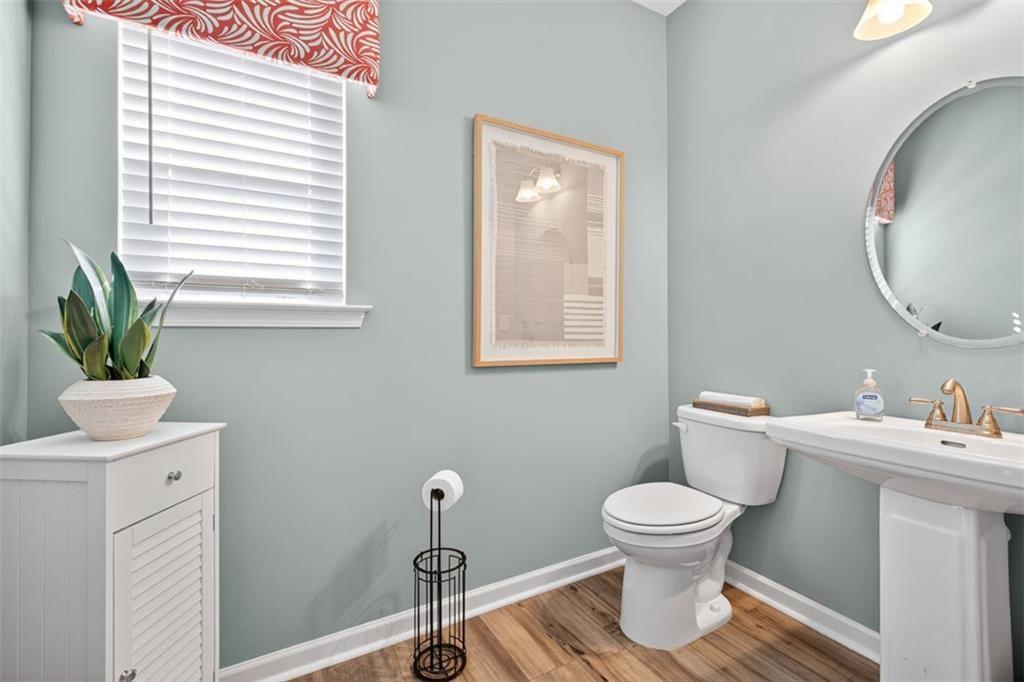 102 Rory Drive Calhoun, GA 30701 - Photo 19 of 38 a bathroom with a toilet a sink and a mirror