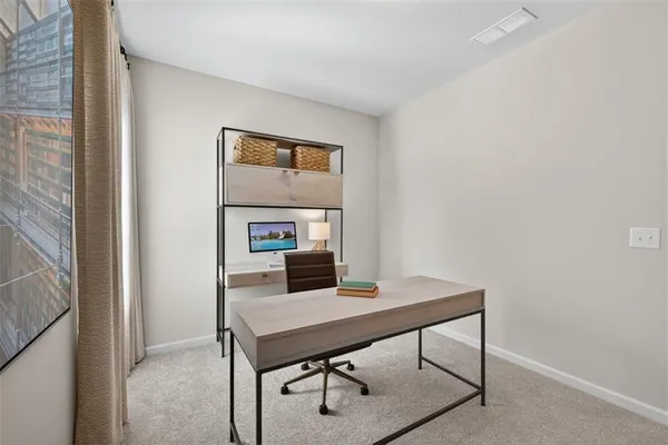 a view of a workspace with furniture