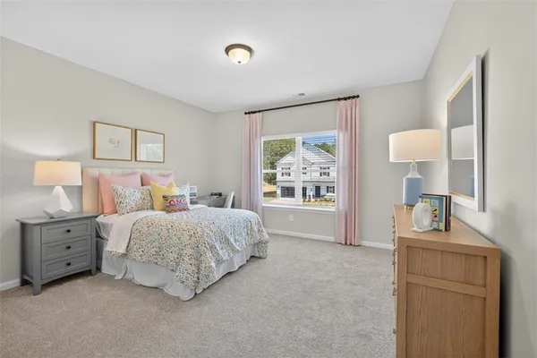 a bed room with a bed and a window