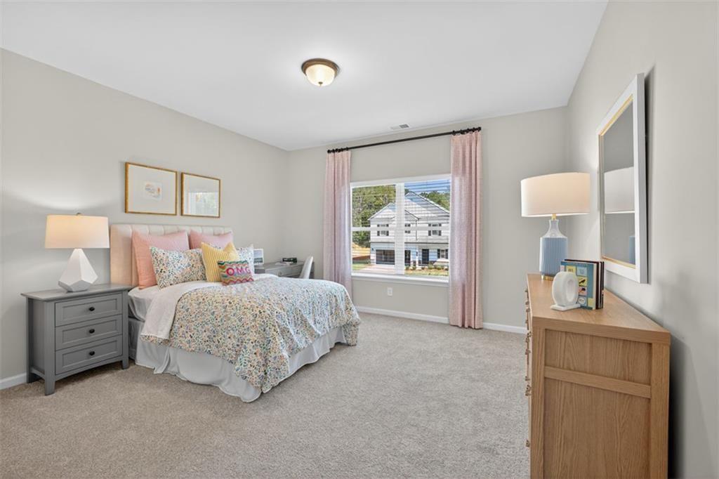 102 Rory Drive Calhoun, GA 30701 - Photo 30 of 38 a bed room with a bed and a window