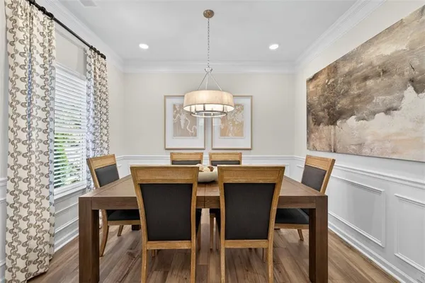 a view of a dining room with furniture window and outside view
