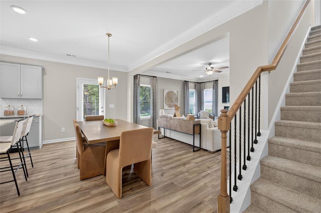 102 Rory Drive Calhoun, GA 30701 - Photo 6 of 38 a view of a dining room with furniture and wooden floor