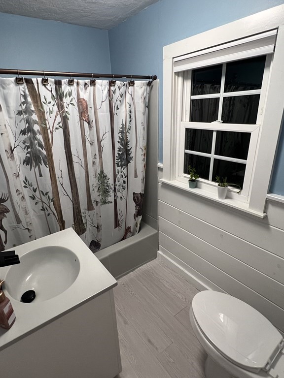 469 Eldridge Street Fall River, MA 02720 - Photo 15 of 40 a bathroom with a toilet and a sink