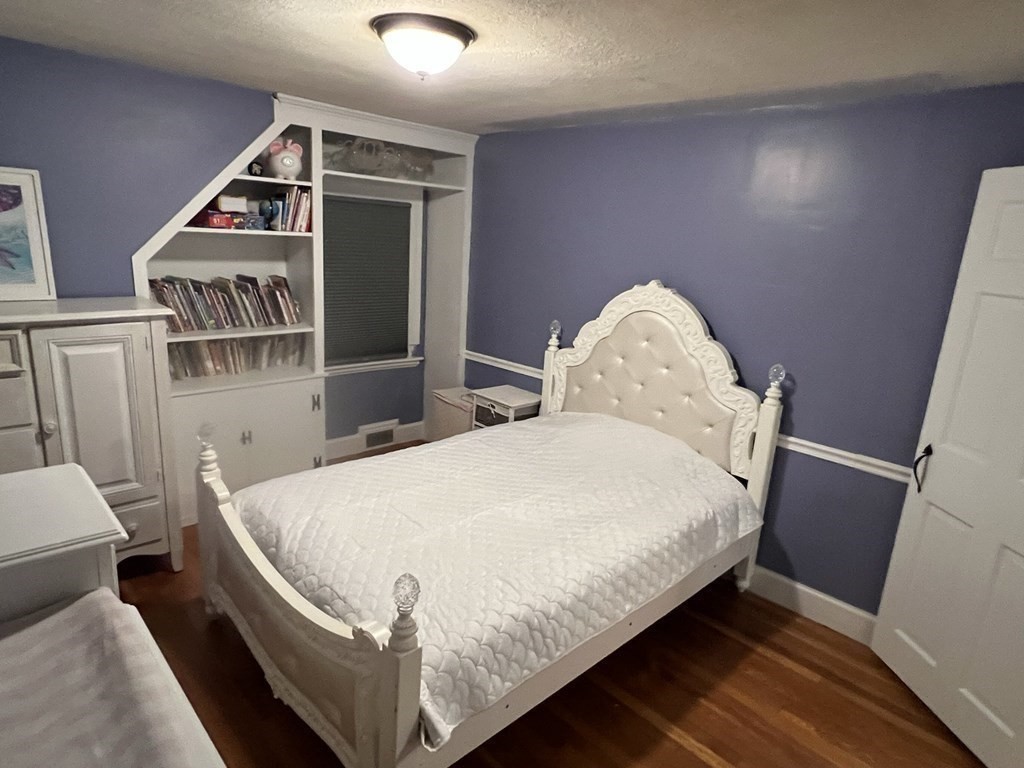 469 Eldridge Street Fall River, MA 02720 - Photo 21 of 40 a bed sitting in a bedroom next to a window