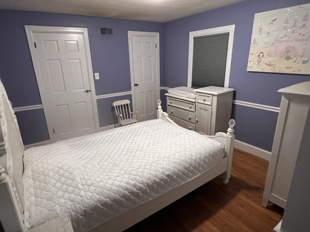 469 Eldridge Street Fall River, MA 02720 - Photo 22 of 40 a large bed sitting in a bedroom and mirror