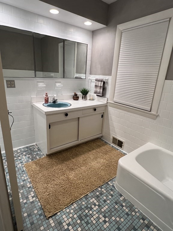 469 Eldridge Street Fall River, MA 02720 - Photo 26 of 40 a bathroom with a sink and a bathtub