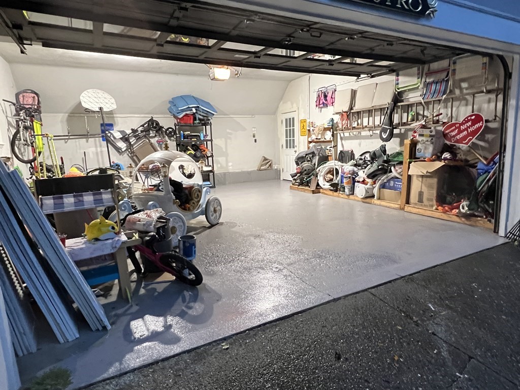 469 Eldridge Street Fall River, MA 02720 - Photo 37 of 40 a view of a garage with a bike and car