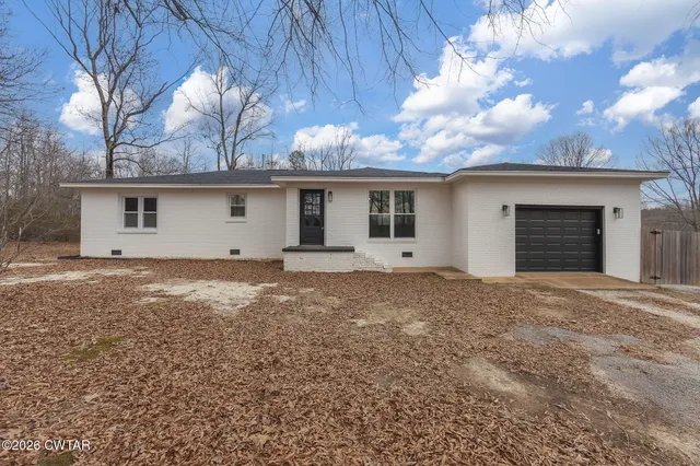 a house view with a backyard space