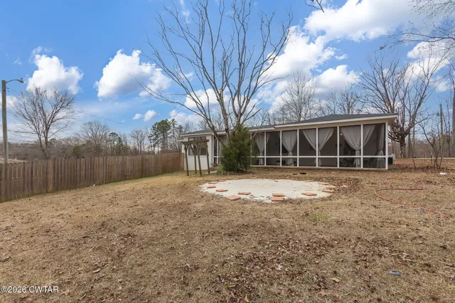 a view of backyard with green space