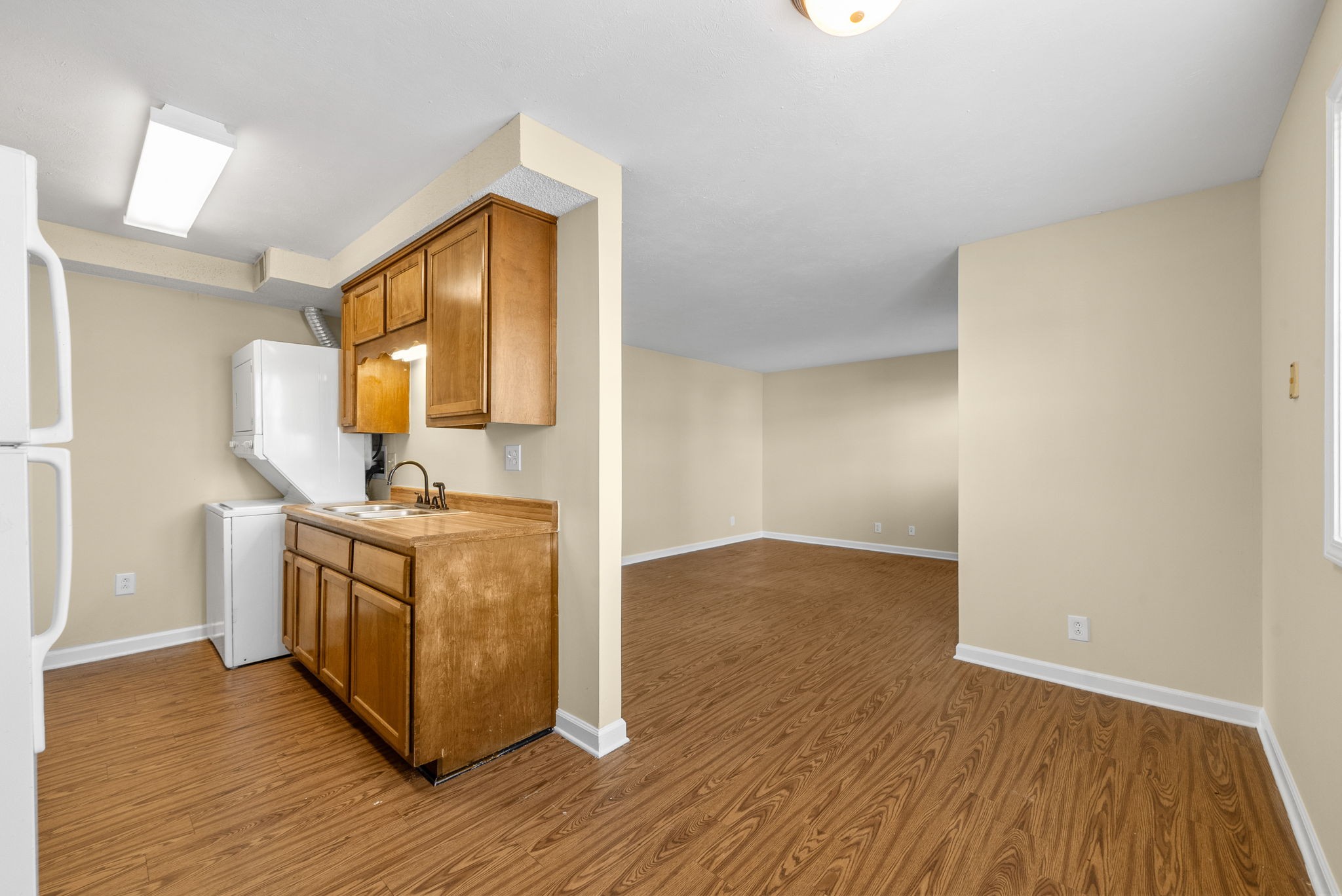 812 Pembroke Oak Grove Road, Unit 14 Oak Grove, KY 42262 - Photo 3 of 11 a room with a wooden floor and washing machine