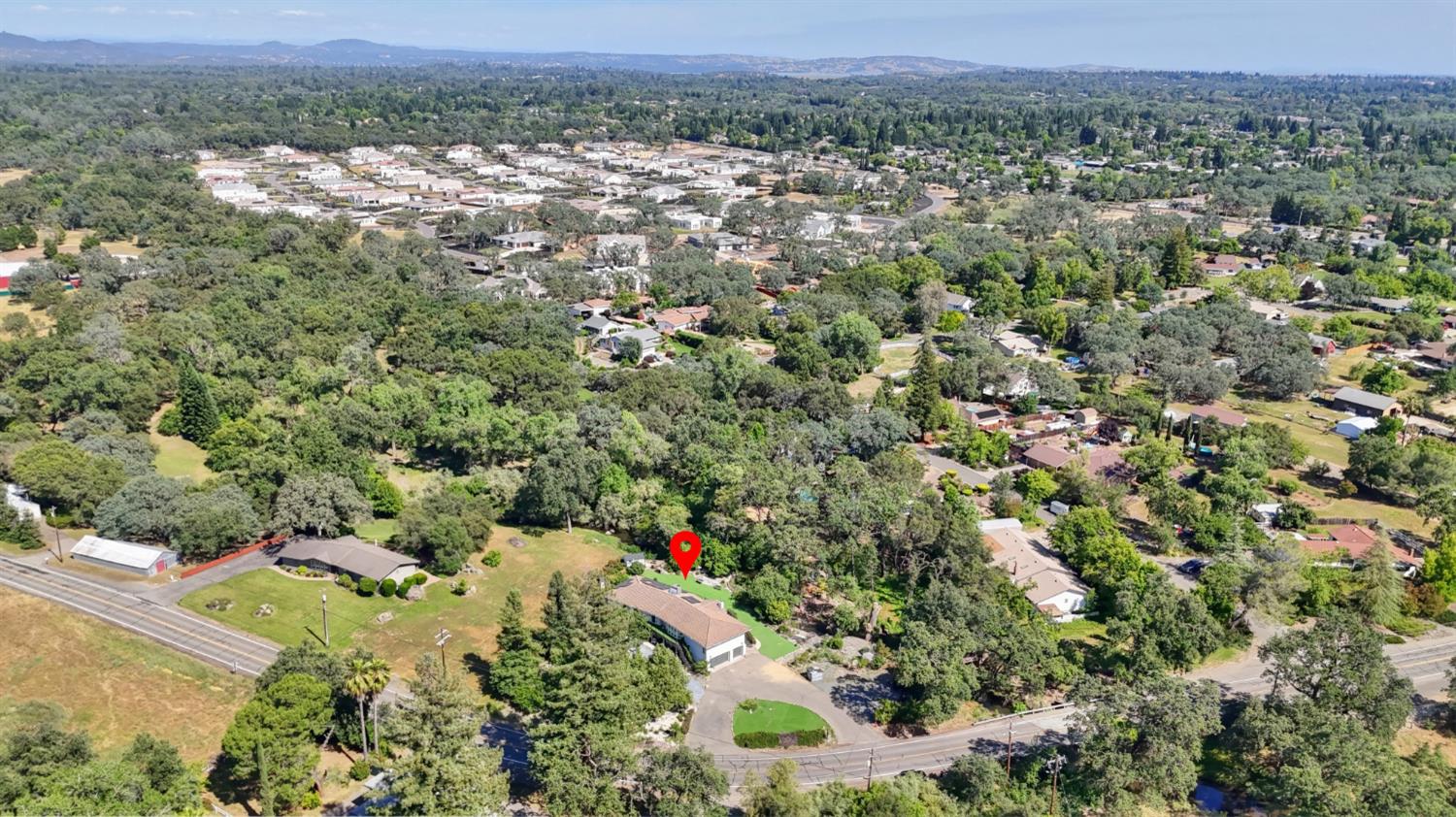 4330 Cavitt Stallman Road Granite Bay, CA 95746 - Photo 84 of 85 an aerial view of a houses with a yard and mountain view