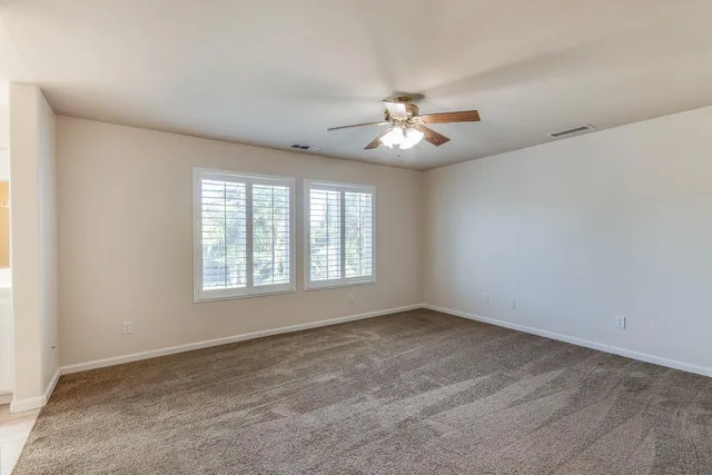 a view of empty room with windows