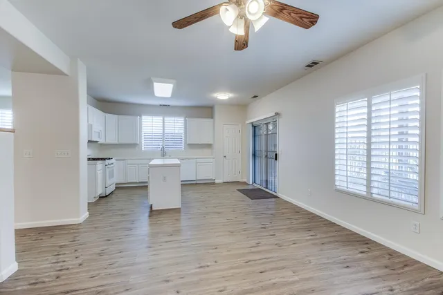 a view of a kitchen with a sink and a window