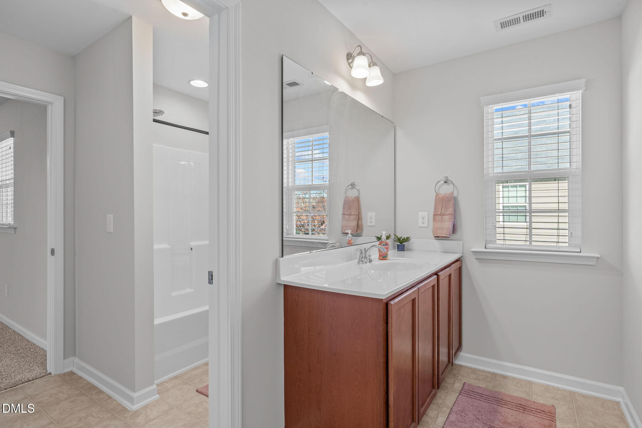 1432 Palace Garden Way Raleigh, NC 27603 - Photo 29 of 40 a kitchen with a sink and dishwasher with wooden floor