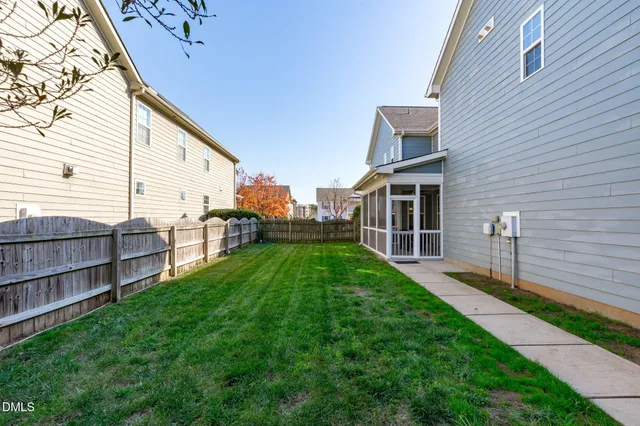 a view of a house with a backyard