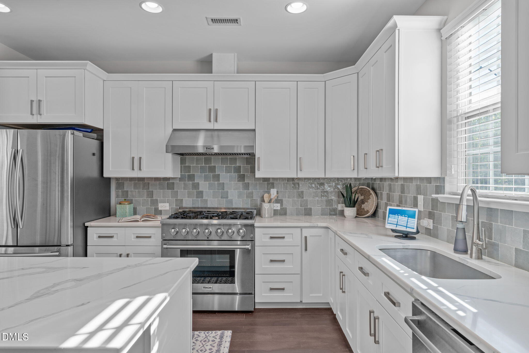 1432 Palace Garden Way Raleigh, NC 27603 - Photo 5 of 40 a kitchen with cabinets appliances a sink and a window