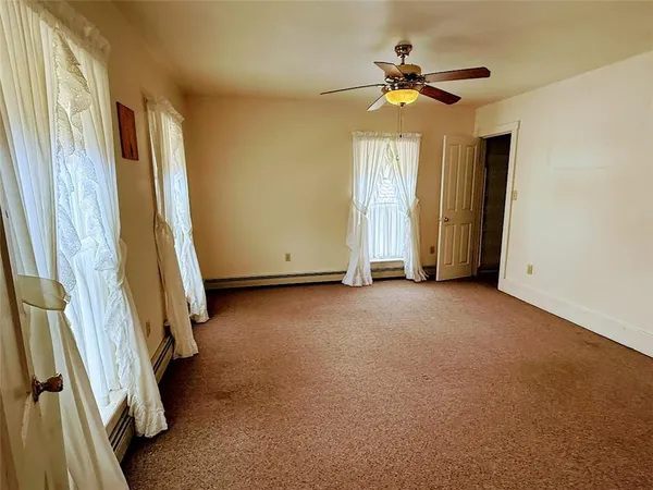 a view of room with ceiling fan