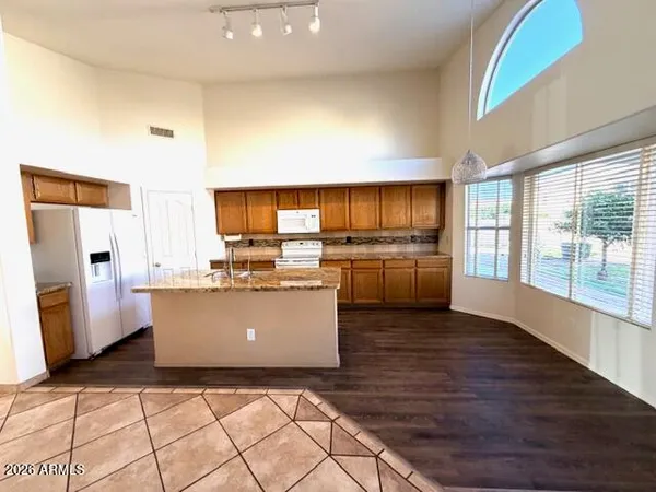 a living room with a couch and a stove top oven