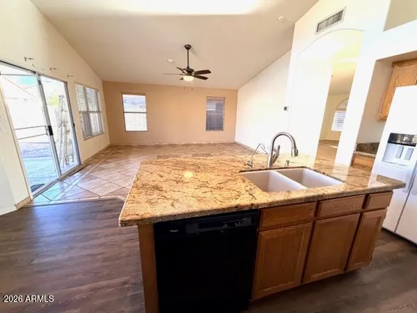 a view of a kitchen from a dining room