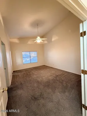 an empty room with a empty space and windows