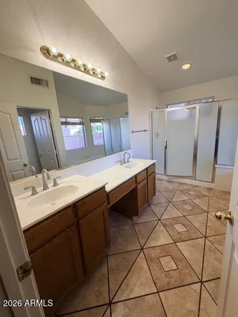 a kitchen with a sink and a refrigerator