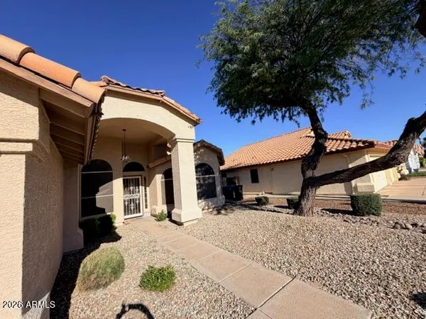 a view of a house with a snow in the background