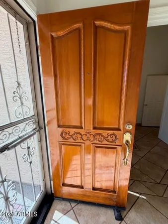 a view of front door with wooden floor