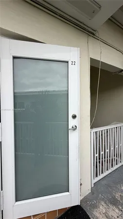 a bathroom with a glass door shower
