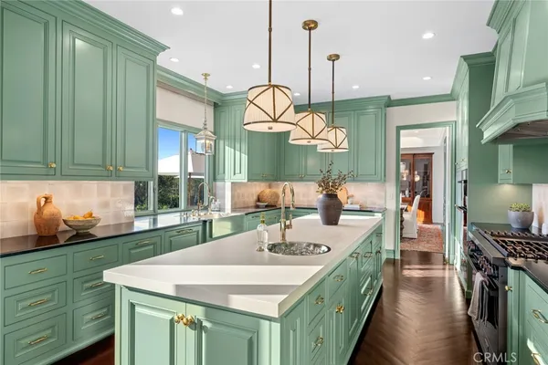 a bathroom with a double vanity sink toilet mirror and shower