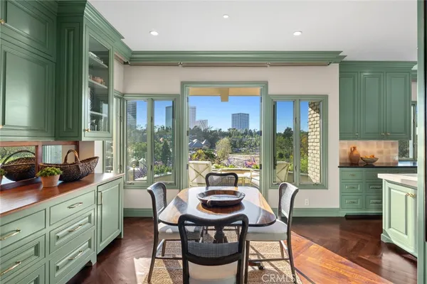 a bathroom with a granite countertop toilet sink and mirror