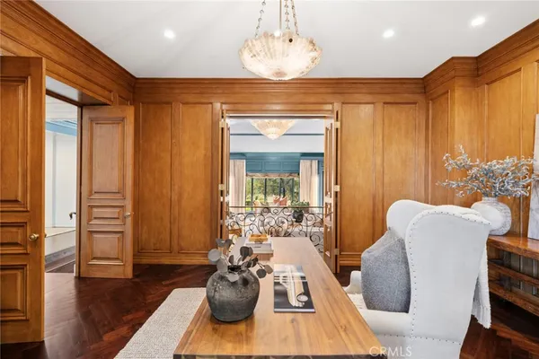 a bedroom with two beds and large window