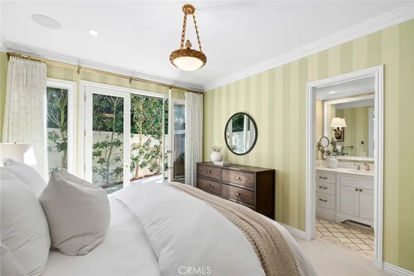 a living room with fireplace furniture and a wooden floor