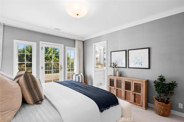 an aerial view of a house with a garden and lake view