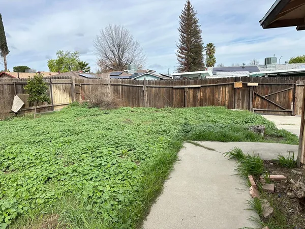 a backyard of a house with lots of green space
