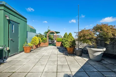 a lobby with furniture and potted plants