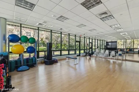a lobby with furniture and a floor to ceiling window