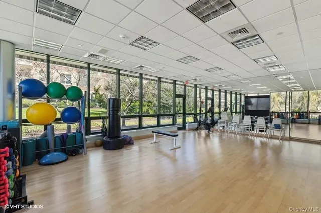 a lobby with furniture and a floor to ceiling window