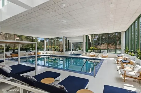 a room with lots of windows and couch