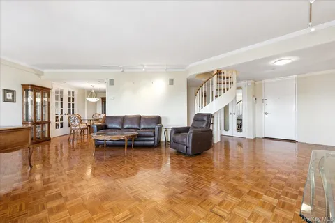 a living room with fireplace furniture and a wooden floor