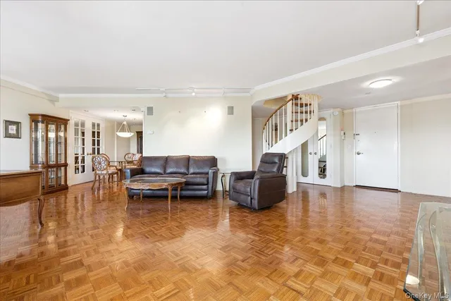 a living room with fireplace furniture and a wooden floor