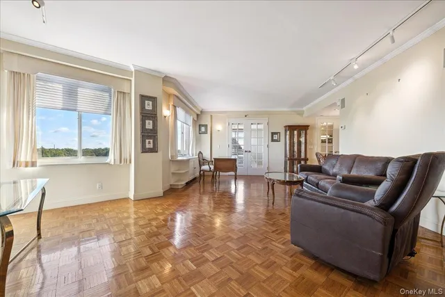 a living room with furniture and a large window