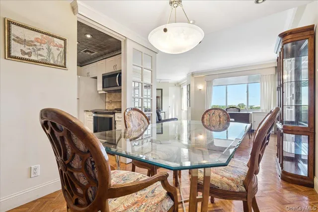 a view of a dining room with furniture window and wooden floor