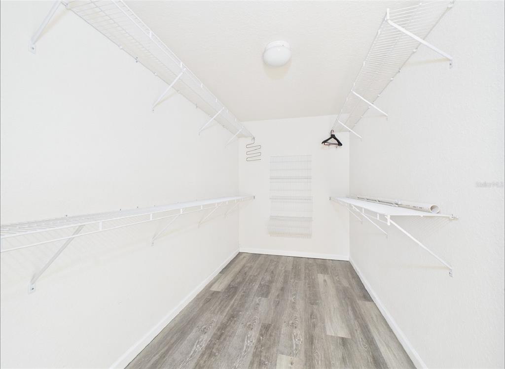 5208 Southwest 39th Street Ocala, FL 34474 - Photo 16 of 55 a view of a room with wooden floor