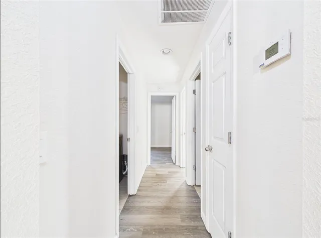 a view of a patio with a table and chairs