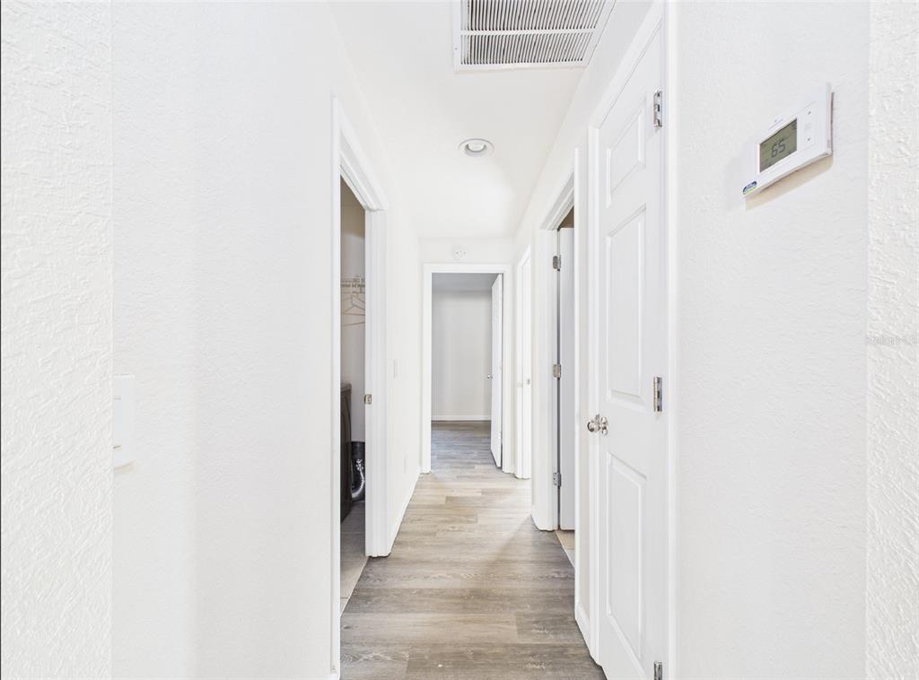 5208 Southwest 39th Street Ocala, FL 34474 - Photo 22 of 55 a view of a hallway with wooden floor and entryway